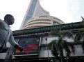 Sensex, Nifty 50 dip, rupee slips to record low on elevated oil prices