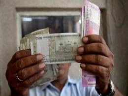 Markets end in the red; rupee at record low, crosses 77.50/$ mark