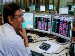 Sensex, Nifty end flat as some banks fall, Reliance gains